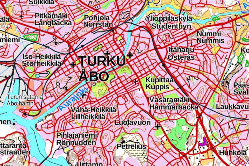 A detailed city map from Turku, FInland. It shows roads and streets in red, different place names in Finnish and Swedish (for example, Pohjola or Norrstan in the Northern part of the city), the blue Aura River and different parks and forests.