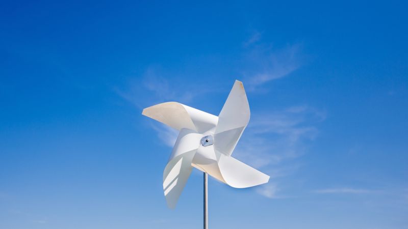 A pinwheel rotates in the wind.